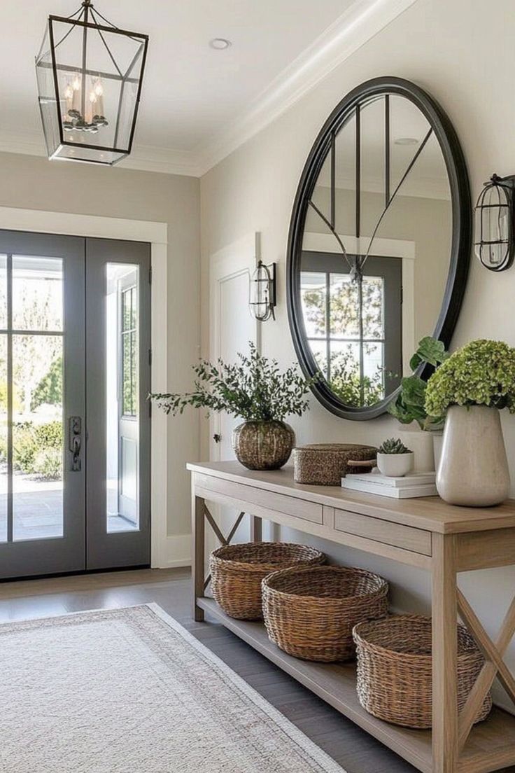 مدخل منزل مزين بطاولة كونسول مميزة التصميم وسجادة أنيقة