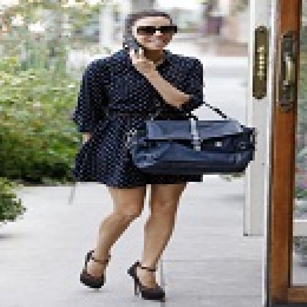 لونغوريا وألبا بحقيبة جلدية من Coach