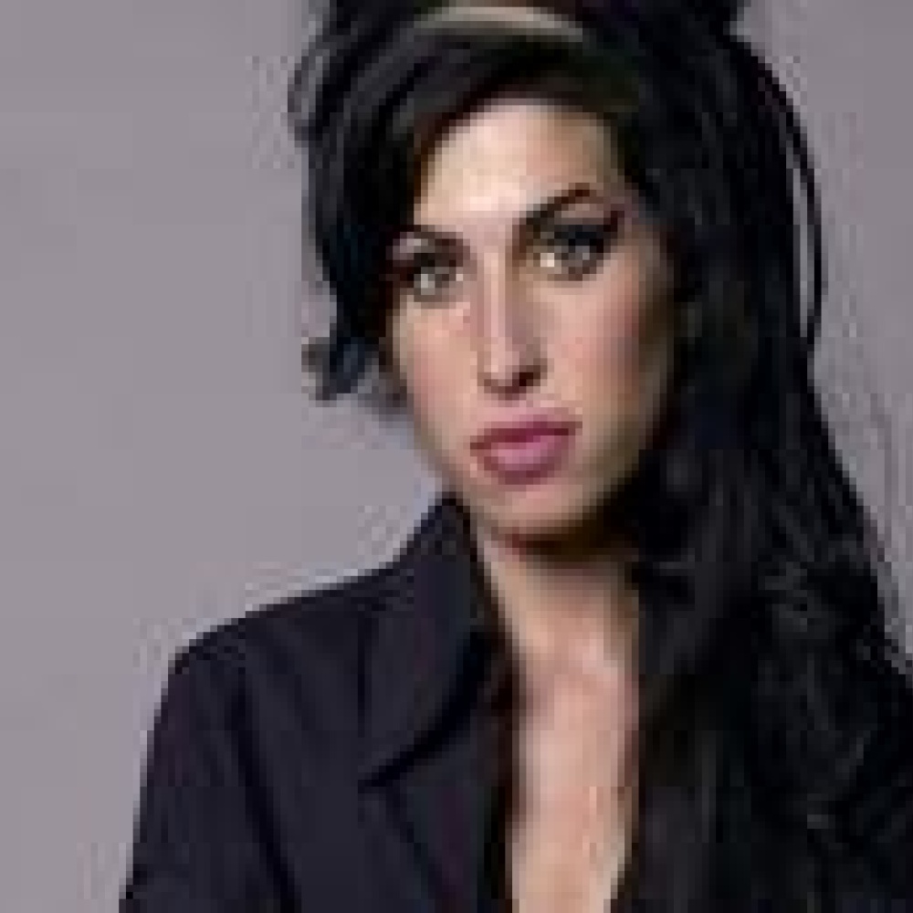 حرق جثمان ايمي وينهاوس في مراسم خاصة