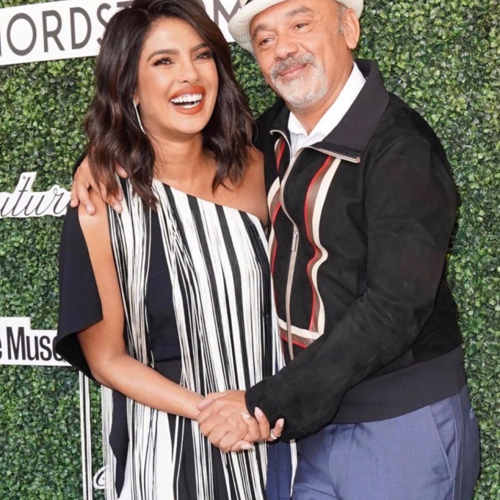 صورة باسمة تجمع بين بريانكا شوبرا وكريستيان لوبوتان في غداء Couture Council Award 2019