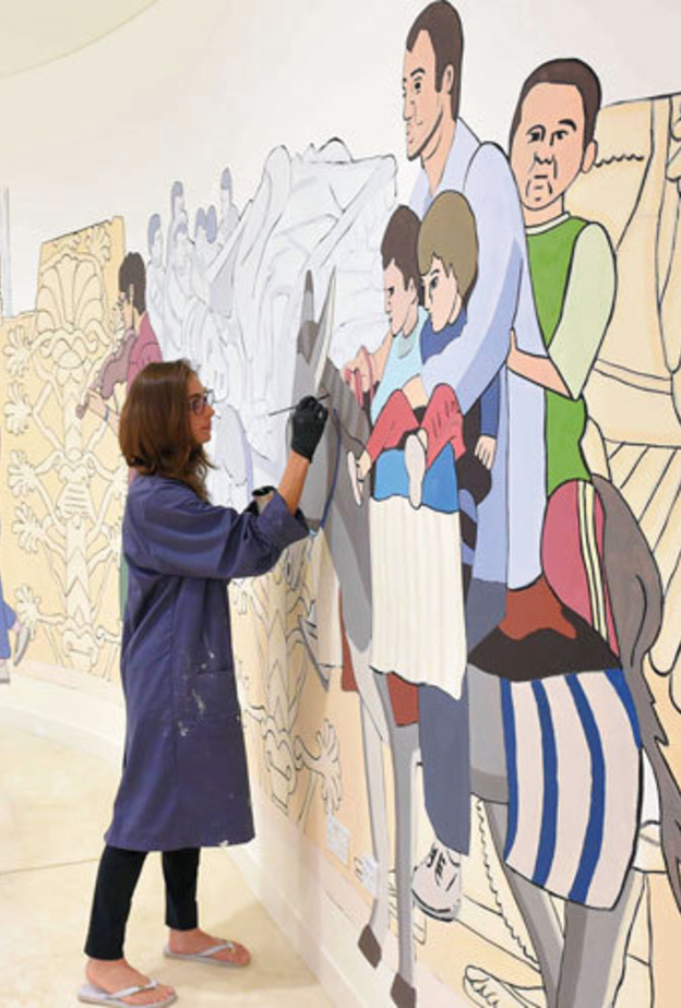 خريجات جامعة زايد يشاركن الينا جالو في انجاز جدارية التسامح والوفاء