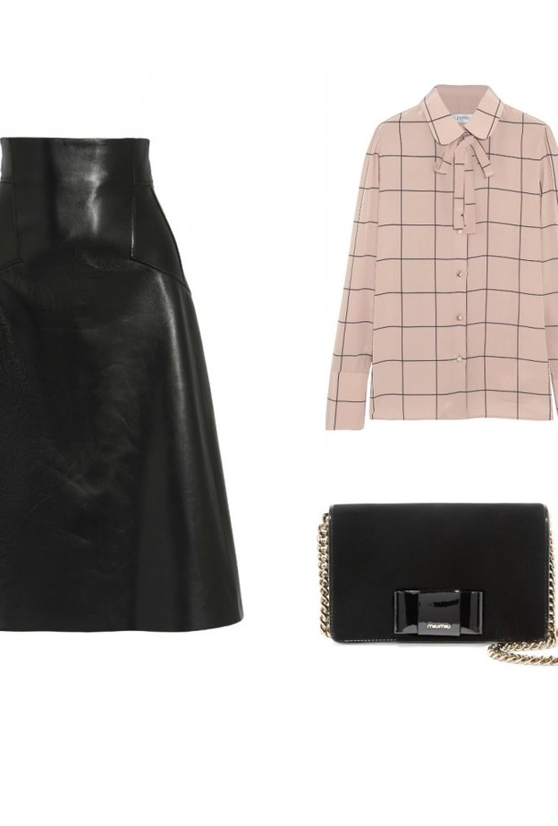 اطلالة راقية بالتنورة الجلدية المتوسطة الطول