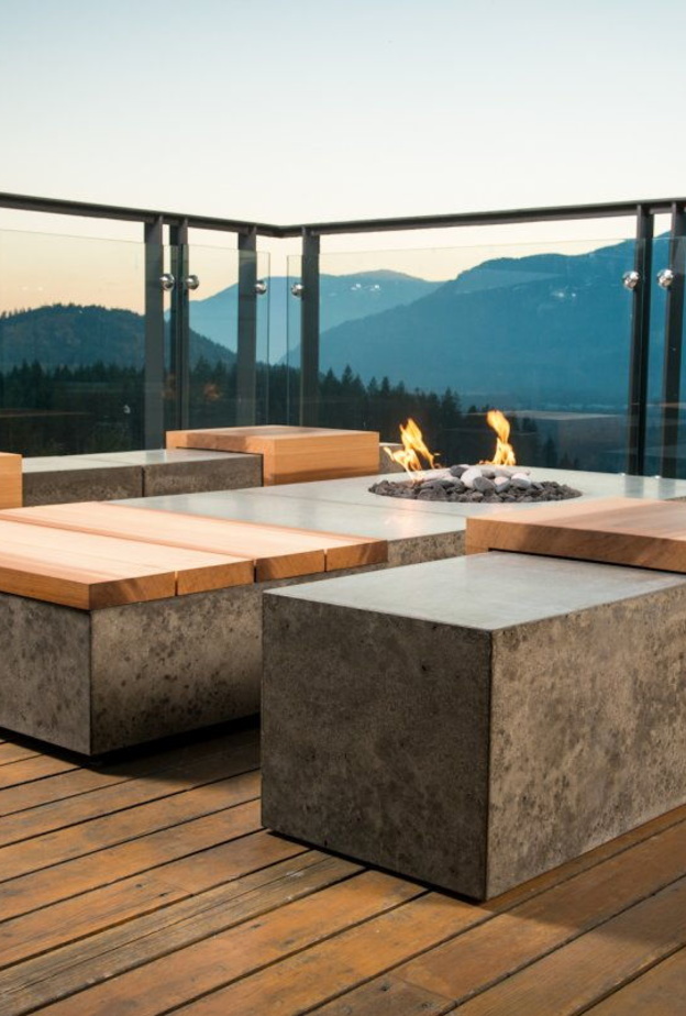 أثاث التراس من الإسمنت و الخشب المعالج مع مدفأة صغيرة  لأيام الشتاء 