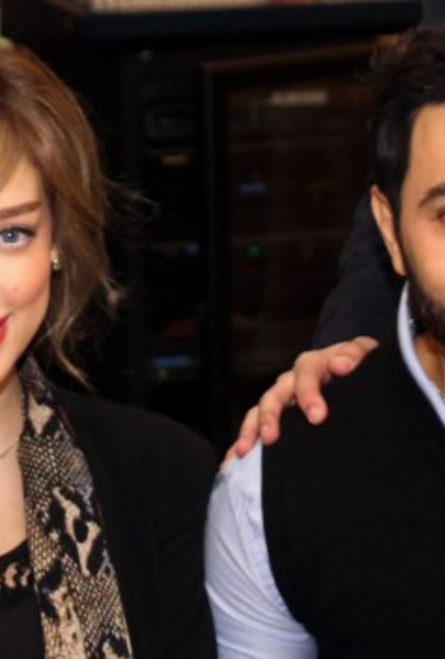 تامر حسني وبسمة بوسيل يتعمدان اخفاء وجه ابنتيهما