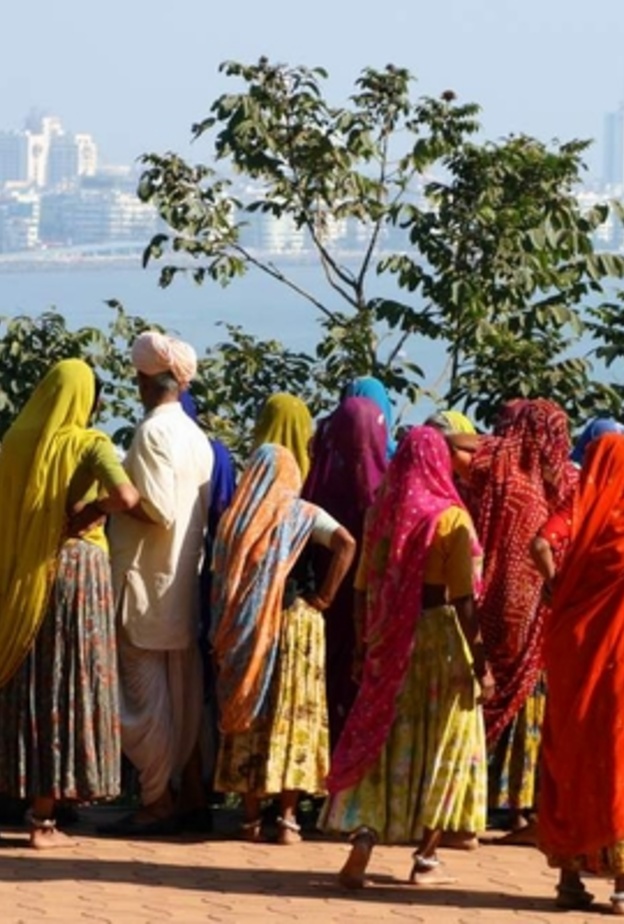 A group of indian women looking at the skyline of mumbai