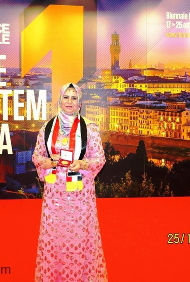  العراقية العبيدي التي فازت بالميدالية الذهبية في المعرض