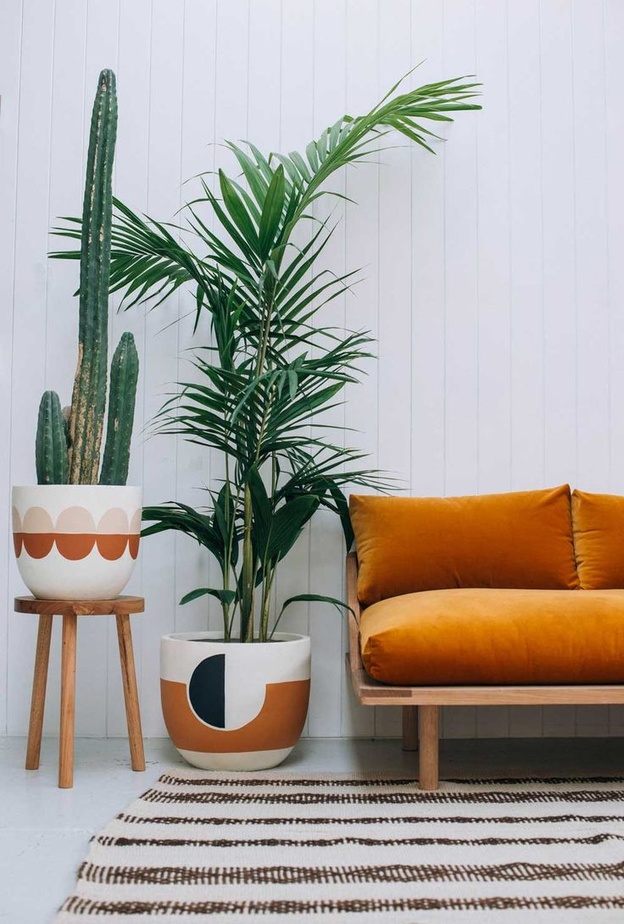 البرتقالي مع الألوان الترابية في ديكورات غرف المعيشة