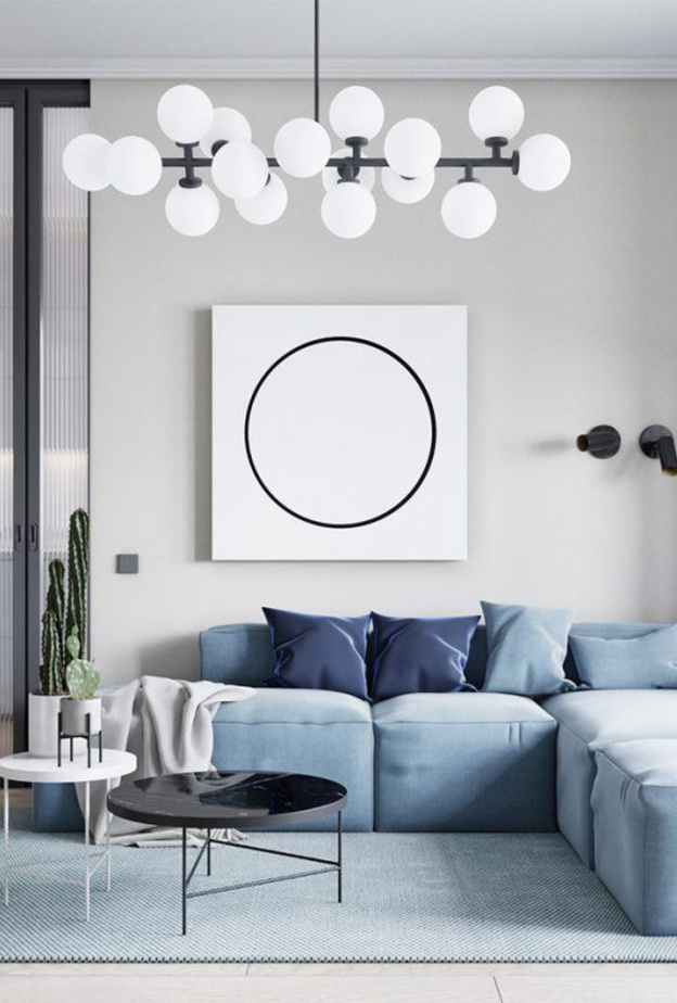 حاجز زجاجي والسجادة تحدد المساحات في ديكورات الشقق الصغيرة