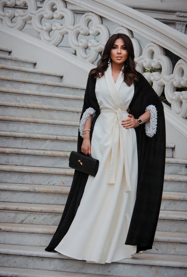 مزيج الأبيض والأسود يغمر أزياءك بتصاميم شرقية تناسب عيد الفطر على خطى النجمات