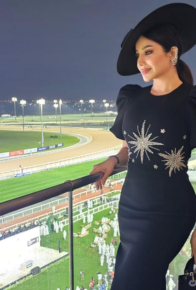 لجين عمران بفستان كلاسيكي ميدي باللون الأسود