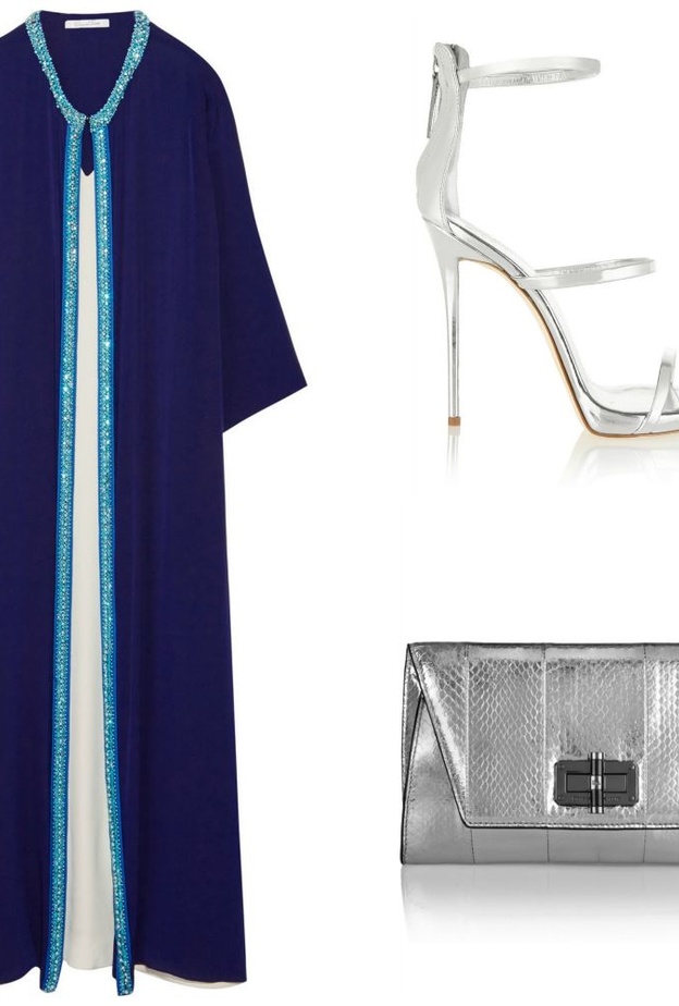 قفطان من اوسكار دي لا رنتا Oscar de la Renta باللون الكحلي من الحرير ومشكوك بالخرز والكريستال على الاطراف ، نسقي معه صندل كعب عالي  فضي وشنطة clutch فضية