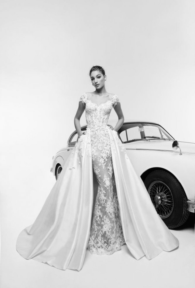 فستان زفاف فخم و راق بموديل التنورة الضخمة الكبيرة للعروس الإستثنائية من مجموعة Reem Acra لربيع 2019.