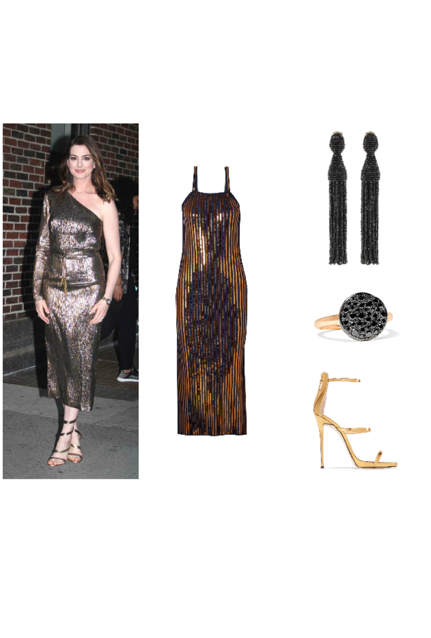 اطلالة لافتة في التنورة البرتقالية من آن هاثاواي.