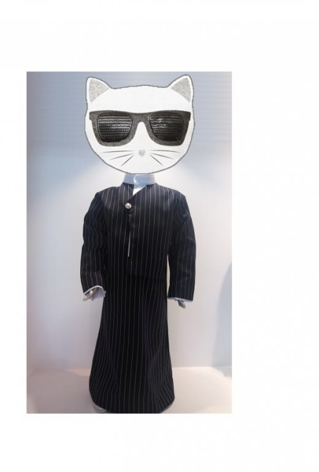 حاتم العقيل يستوحي مجموعة أثواب الأطفال من الراحل كارل لاغرفلد