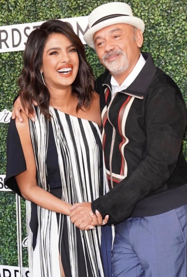 صورة باسمة تجمع بين بريانكا شوبرا وكريستيان لوبوتان في غداء Couture Council Award 2019