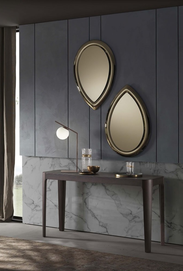 الزجاج مع المعدن في تصميم كونسول عصري