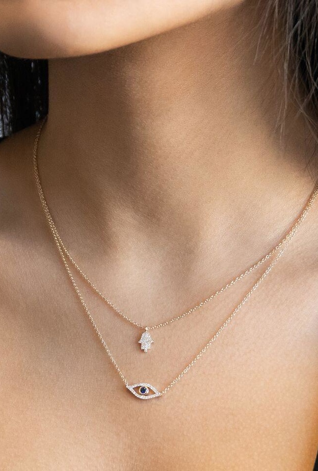  جاذبية عصرية في تكديس مجوهرات الكف والعين