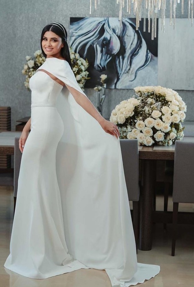  تألقت العروس بفستان ابيض بسيط وناعم