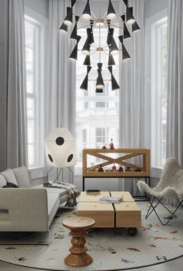 ديكور غرفة معيشة يتميز بالسجادة الدائرية ورسوماتها الناعمة