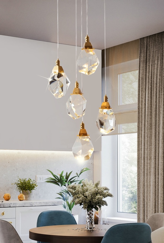 أجهزة إنارة رائعة فوق طاولة الطعام في المطبخ