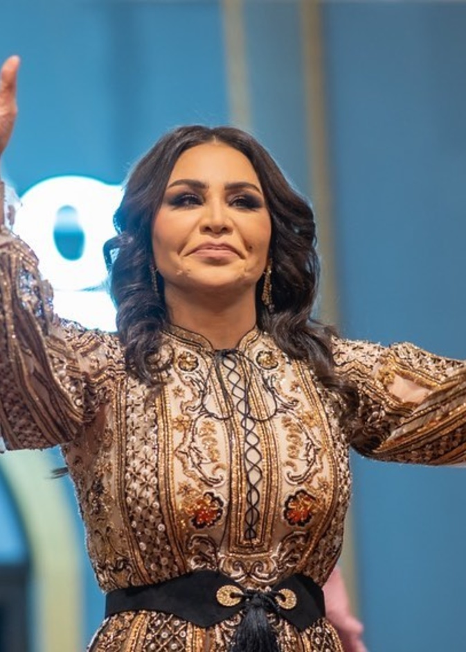 إطلالة أحلام بمعرض العطور