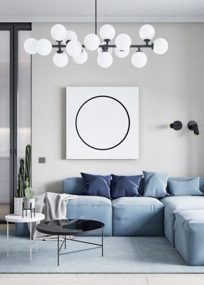 حاجز زجاجي والسجادة تحدد المساحات في ديكورات الشقق الصغيرة