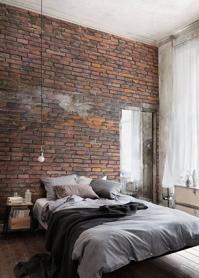 الجدار الحجري واللون الرمادي يضفي لمسة ذكورية على ديكورات غرفة نوم 