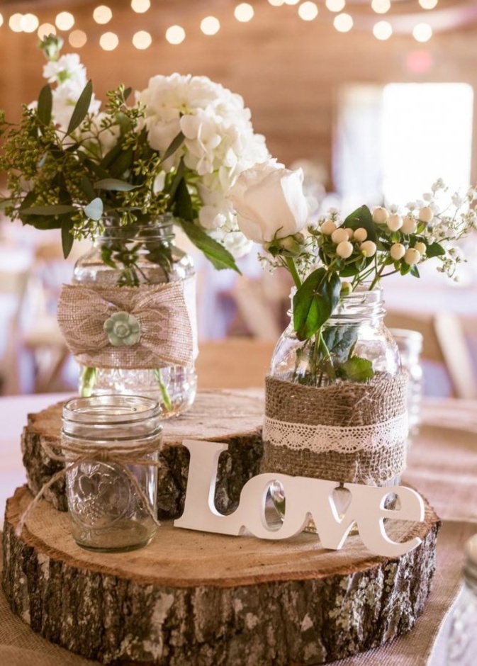 من افكار ديكورات حفل الزفاف من المزهريات الطويلة