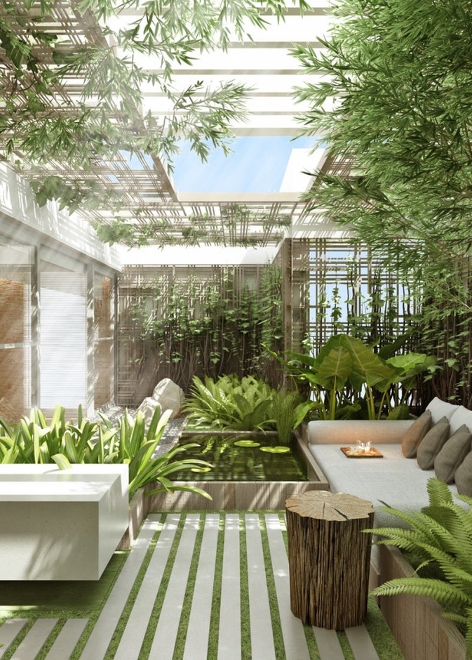  حديقة منزلية صغيرة تتوزع فيها أحواض النباتات من حول بحرة مائية صغيرة