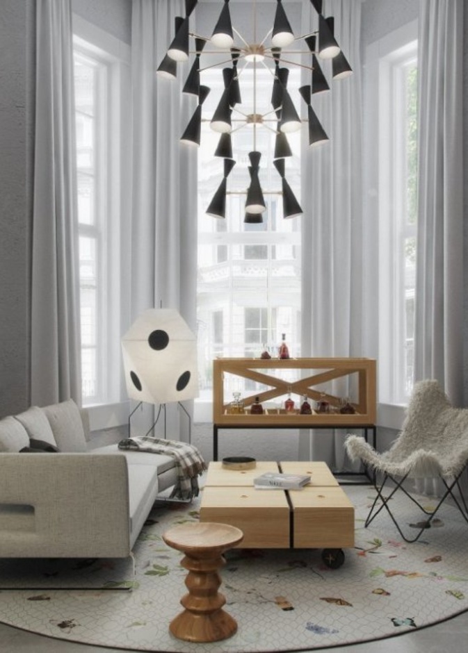 ديكور غرفة معيشة يتميز بالسجادة الدائرية ورسوماتها الناعمة