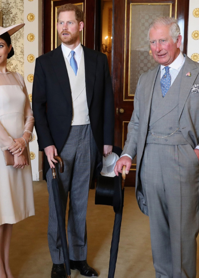 الأمير تشارلز والأمير هاري وزوجته ميغان ماركل 