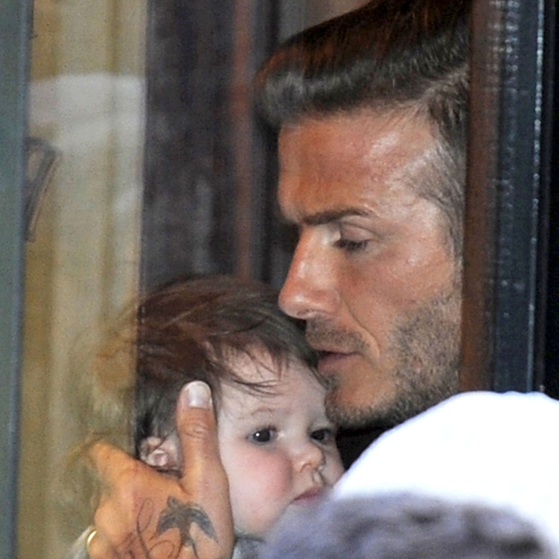 David Beckham holds onto daughter Harper while leaving Balthazar Restaurant after dining out with wife Victoria
