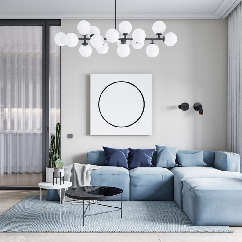 حاجز زجاجي والسجادة تحدد المساحات في ديكورات الشقق الصغيرة