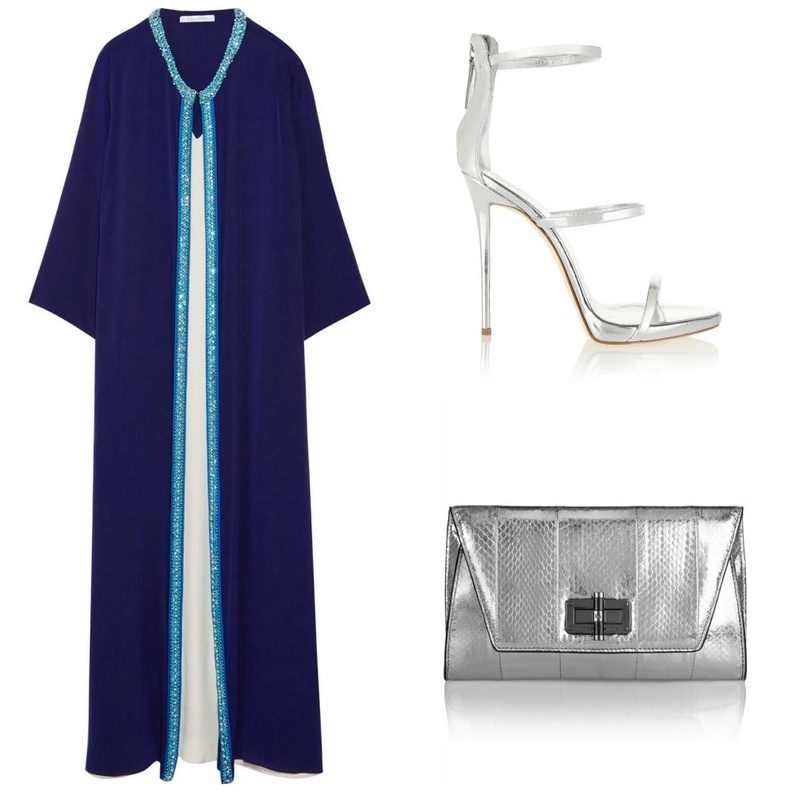 قفطان من اوسكار دي لا رنتا Oscar de la Renta باللون الكحلي من الحرير ومشكوك بالخرز والكريستال على الاطراف ، نسقي معه صندل كعب عالي  فضي وشنطة clutch فضية