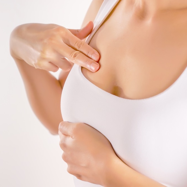 اسباب واعراض مرض كتل الثدي وطرق علاجه