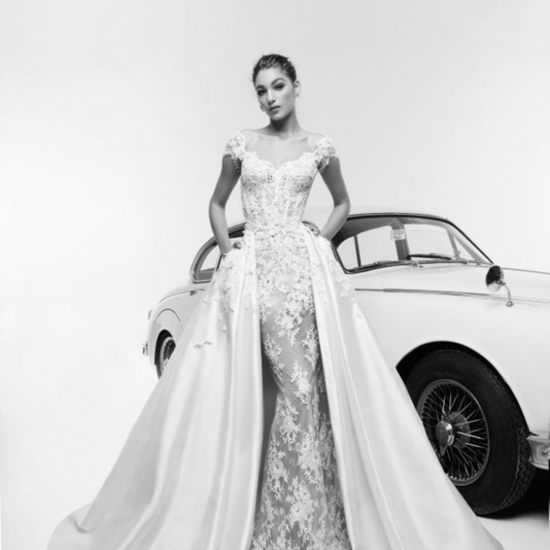 فستان زفاف فخم و راق بموديل التنورة الضخمة الكبيرة للعروس الإستثنائية من مجموعة Reem Acra لربيع 2019.