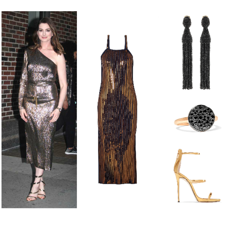 اطلالة لافتة في التنورة البرتقالية من آن هاثاواي.