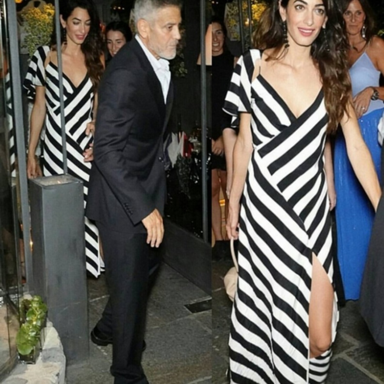 أمل كلوني بموضة الملابس المقلمة والحيوية