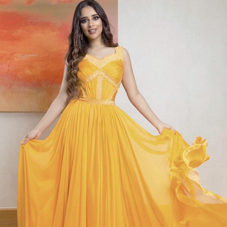 اختاري فستان اصفر من بلقيس فتحي بقماش التول وتصميم انطوان القارح