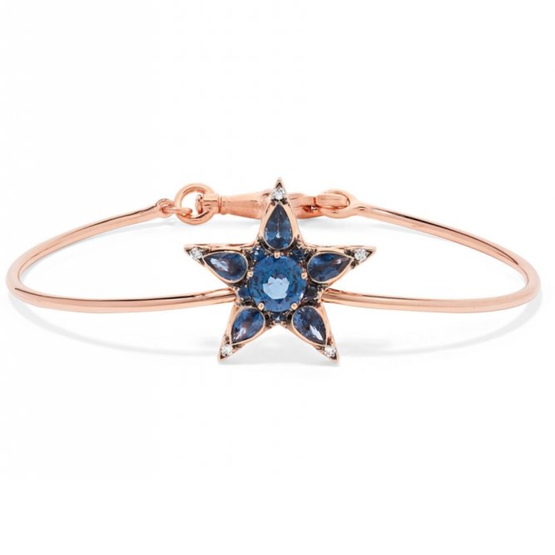 أقراط من الذهب بأشكال النجوم مزينة بالماسات وحجر التانزانيت من Carol Kauffman