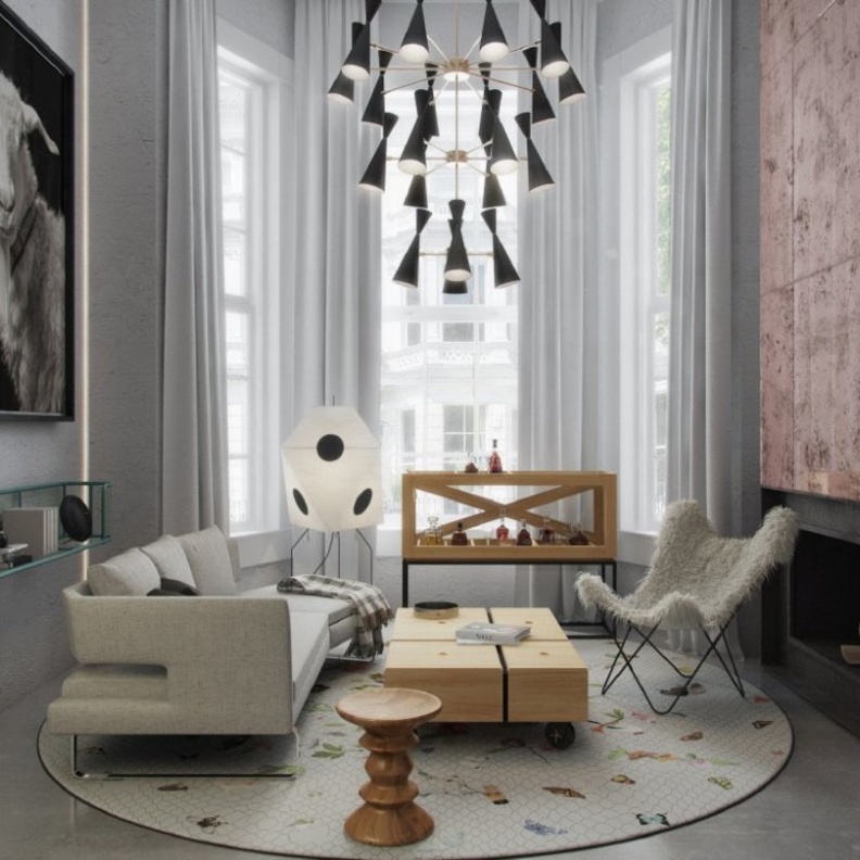 ديكور غرفة معيشة يتميز بالسجادة الدائرية ورسوماتها الناعمة