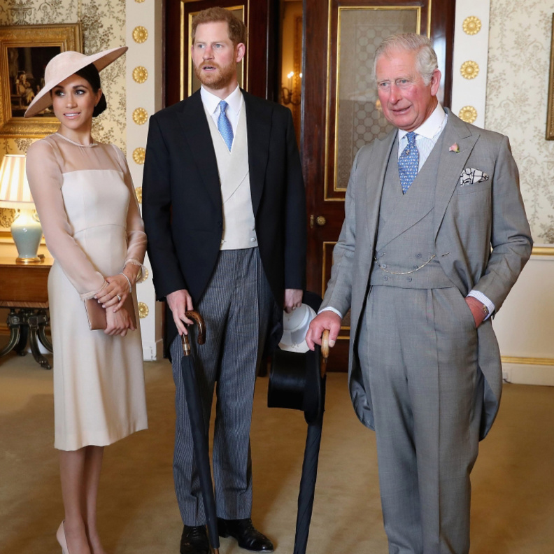 الأمير تشارلز والأمير هاري وزوجته ميغان ماركل 