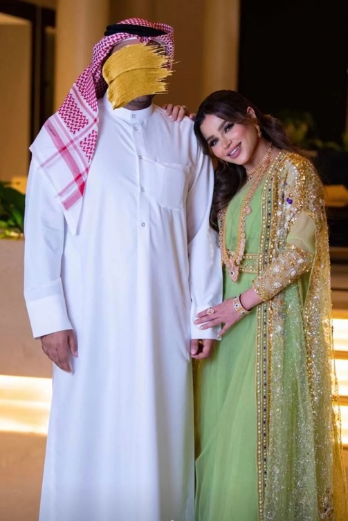 نهى نبيل تحرص على إخفاء ملامح زوجها