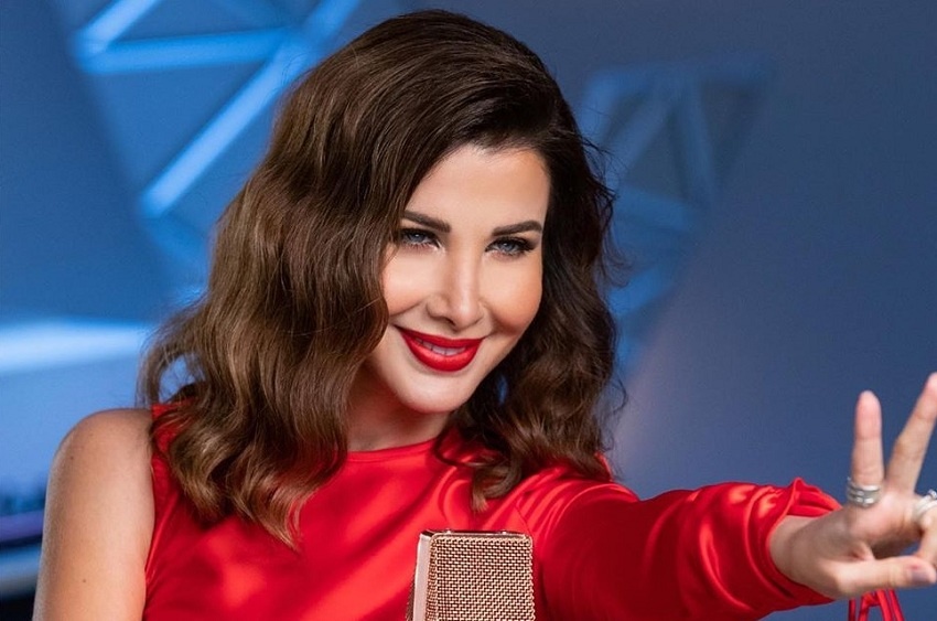 نانسي عجرم بإطلالة سابقة لها بالروج الأحمر