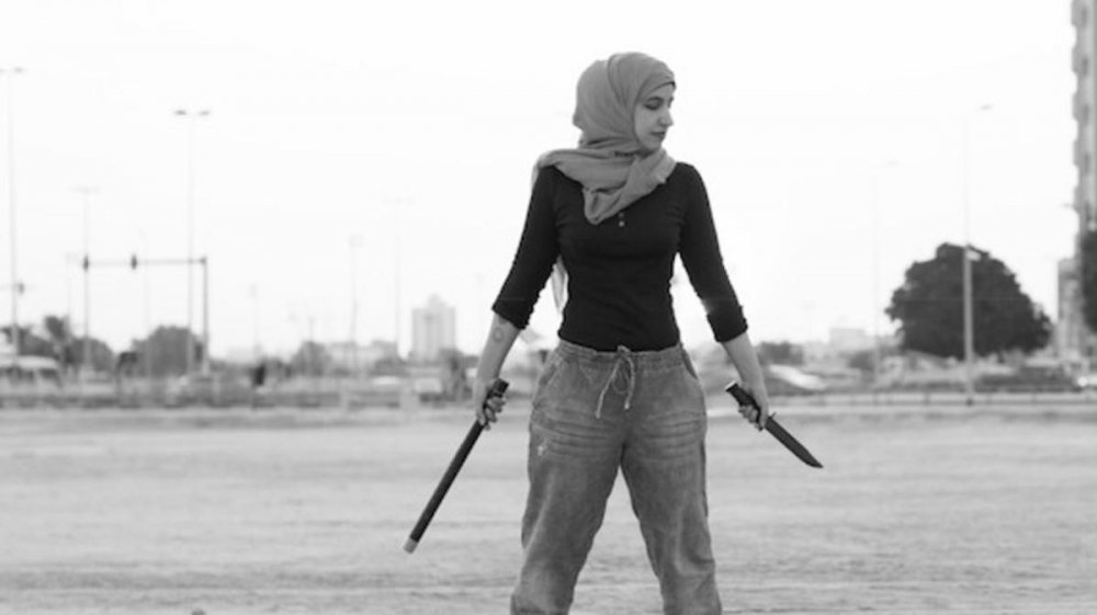 ريم العودة أثناء ممارستها فن الدوجا القتالي